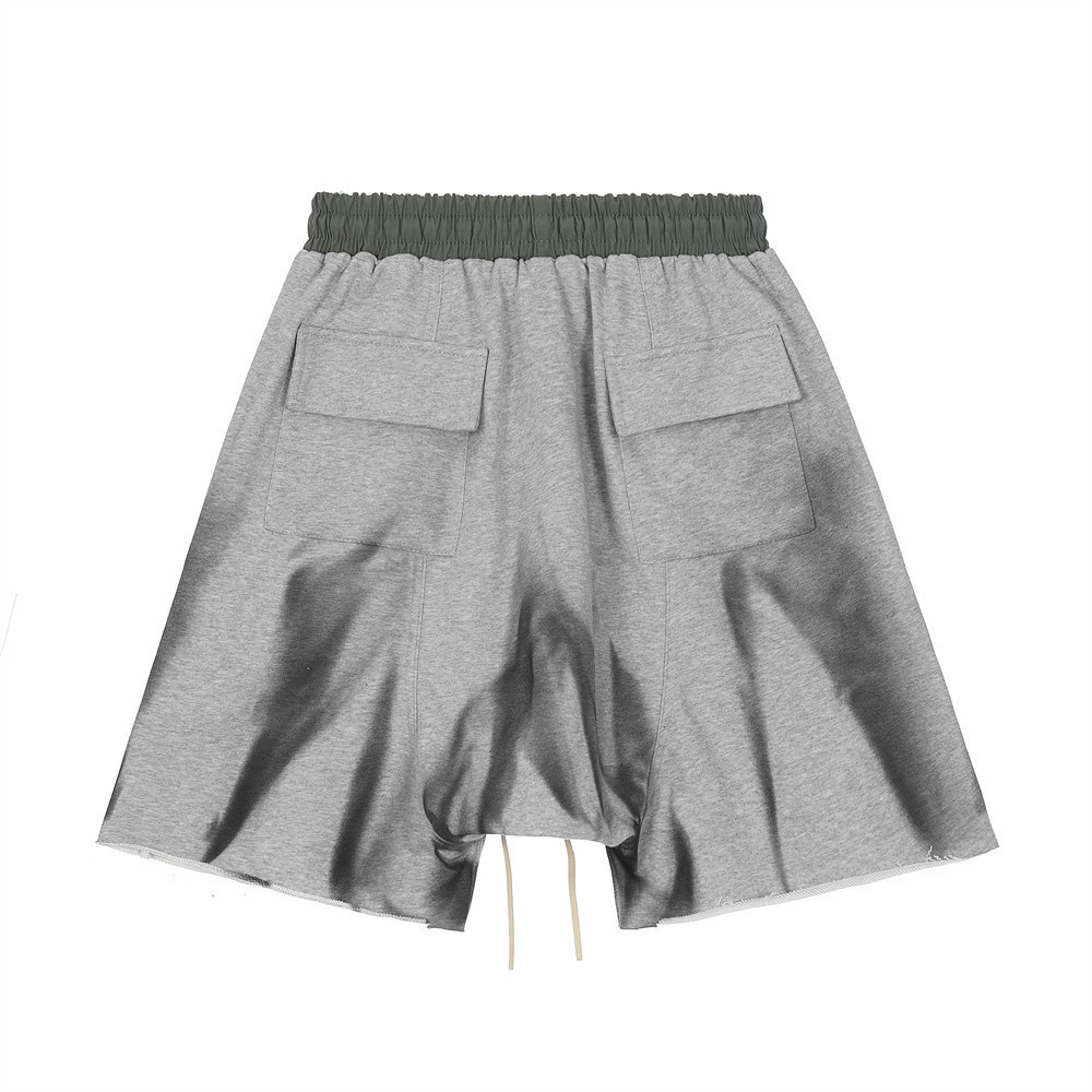 Zip pocket raw edges colour blocked lace-up spray-painted sports shorts